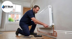 Professional heating engineer installing a new radiator in a Sheffield home